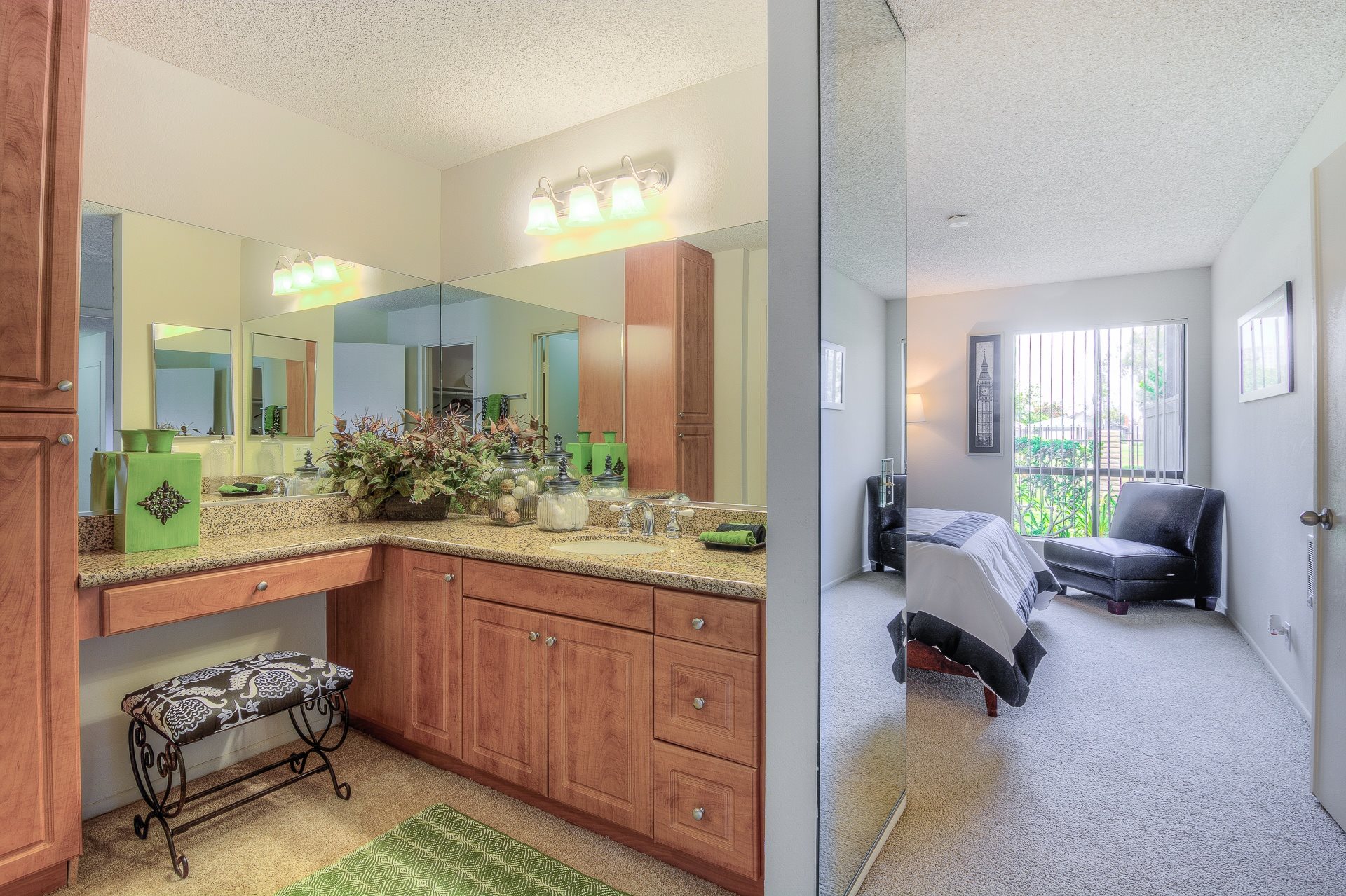 A well-lit kitchen with a large island and a dining area with a table and chairs.,A well-lit kitchen with a large island and a dining area with a table and chairs.